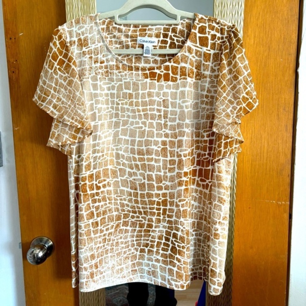 Animal print top with fluttery short sleeve.